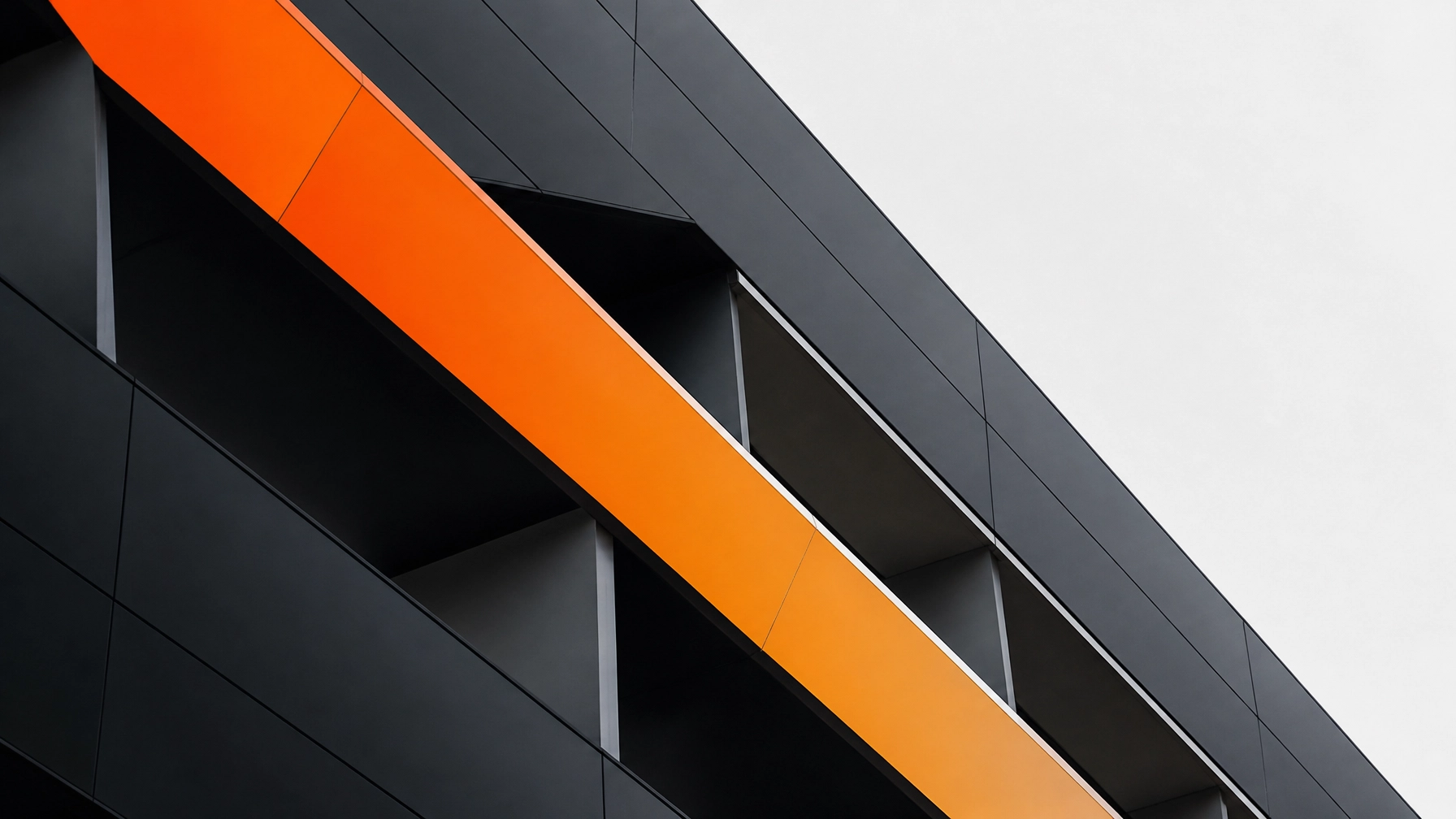 Abstract architectural photography of modern geometric lines with vibrant orange accents