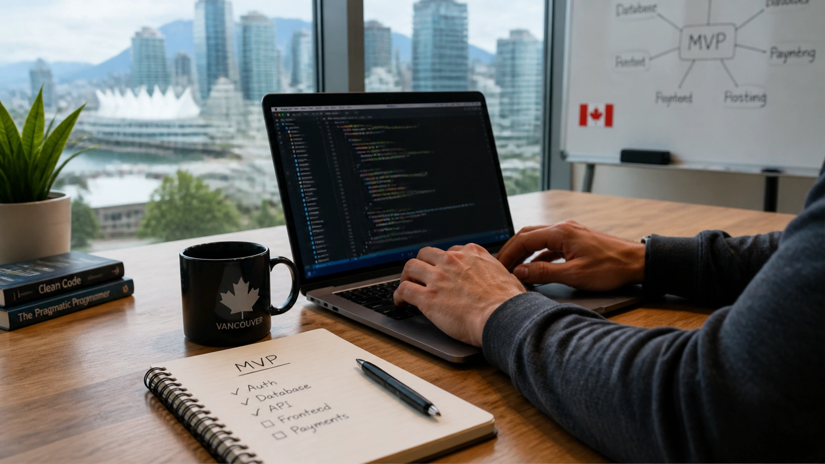 Canadian software developer working on a laptop with natural daylight in a modern office